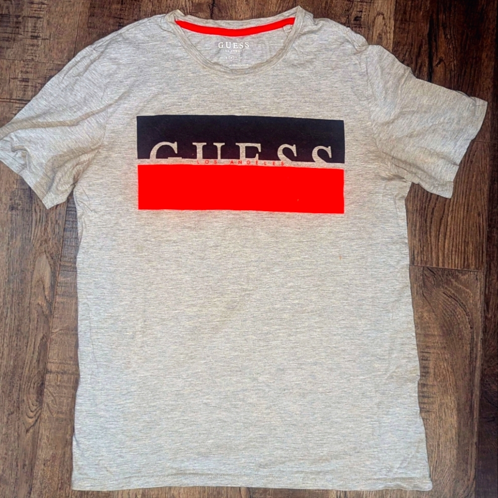 Classic grey vintage GUESS T-shirt with red and black classic GUESS logo design.